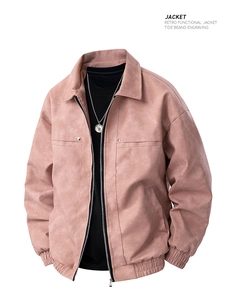 Macro view of retro dusty pink jacket featuring ribbed hem and metallic zipper details