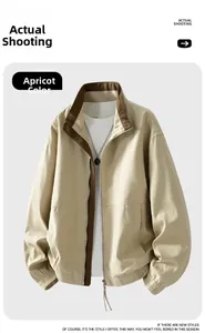 Detail view of apricot Harrington jacket featuring stand-up collar with corduroy lining
