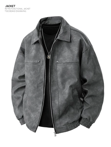 Detail of retro grey biker jacket with brushed texture and metal zipper