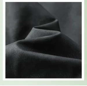 Macro shot of dark grey high-density woven fabric with soft snow velvet texture