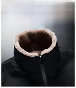 Detail of windproof stand-up collar with warm brown fleece lining on black jacket