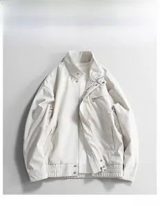 Detail view of almond chenille jacket with stand collar and chest zipper pocket