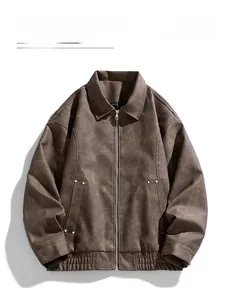 Detailed view of brown faux leather jacket featuring a classic collar and side rivet pockets