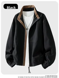 Detail of black stand collar jacket with brown contrast piping and sturdy metal zipper