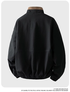 Detailed back view of a black casual jacket showing horizontal seams and brown fabric collar