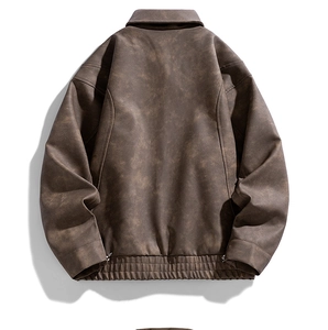 Rear view of brown retro workwear jacket with elastic hem and textured fabric detail