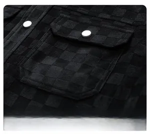 Close-up of black checkerboard suede jacket showing dual flap pockets and silver buttons