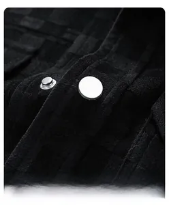 Macro shot of silver metal button closure and checkered faux suede jacket texture