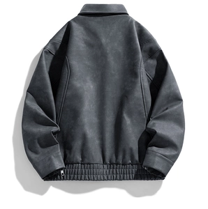 Detail of grey windproof jacket back with textured fabric and elasticated hemline