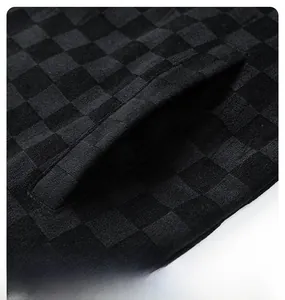 Close-up of side pocket and black checkerboard suede fabric texture on men jacket
