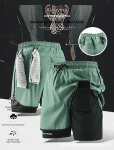 Detail view of 2-in-1 sage green gym shorts with phone pocket and towel loop