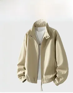 Detail of khaki stand collar jacket with metal buckles and ribbed elastic cuffs