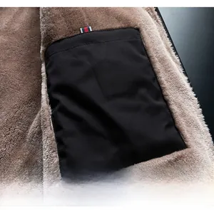 Detail view of the secure inner pocket with tricolor ribbon on thick fleece lining