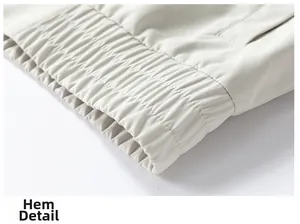 Detail view of the elastic chenille hem and windproof fabric on this men's casual jacket