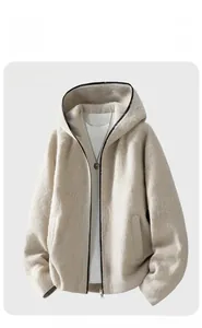 Detail of apricot fleece zip-up hoodie featuring plush fabric texture and metal zipper