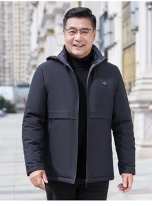 Detail of windproof hooded jacket featuring warm fleece lining and chest logo emblem