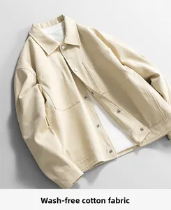 Detail of men's casual jacket showing non-wash twill cotton fabric and metal buttons