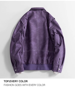 Macro shot of purple suede jacket back with contrasting white stitching and ribbed hem