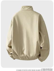 Detailed back view of a light khaki cotton twill jacket with elastic cuffs and collar