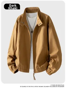 Detail view of dark khaki cotton canvas jacket featuring a stand collar and metal zipper