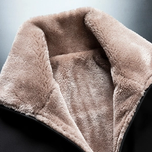 Close-up of thick fleece lining and warm collar on middle-aged men's winter jacket