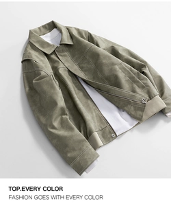 Detailed view of gray-green faux suede jacket featuring contrast stitching and metal zipper