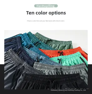 Detail view of quick-dry athletic shorts in various colors with drawstring elastic waist