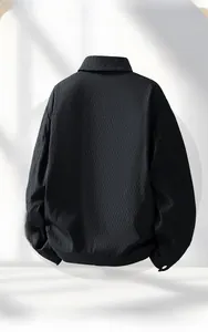 Rear view of black men's casual jacket showing lapel collar and elastic ribbed hem