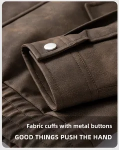 Close-up of vintage brown PU jacket sleeve with metallic snap button and detailed stitching