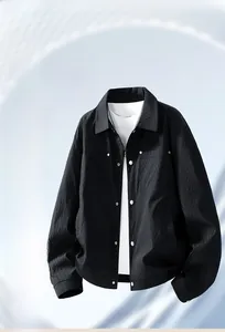 Detailed macro view of black casual jacket with vertical texture and metal pocket rivets