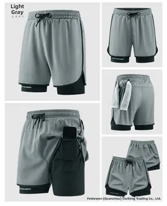 Detail view of 2-in-1 shorts featuring a phone pocket, towel loop, and light gray fabric