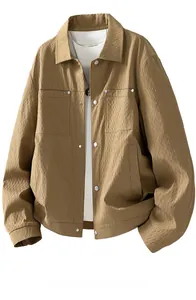 Detailed view of khaki worker jacket featuring unique vertical crinkle texture and metal buttons