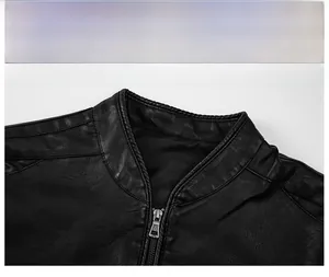 Detail of the stand-up collar design and metal zipper on black leather jacket