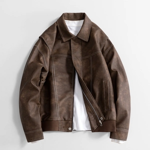 Brown vintage faux leather jacket featuring contrast white stitching and ribbed hem