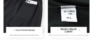 Detail of internal phone pocket and fabric label on black quick-dry training shorts