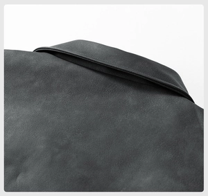 Macro shot of the collar and shoulder seams showing fine stitching on the faux leather jacket