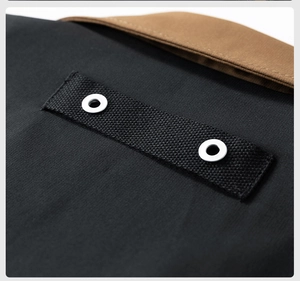 Detail view of American vintage pilot jacket with brown collar and metal rivets