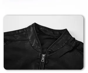Detail view of a black stand collar faux leather jacket with antique silver metal zipper