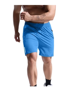 Detail of royal blue quick-dry sports shorts with reflective strip and zipper pocket