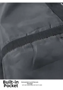 Macro shot of dark grey jacket internal pocket detail with smooth fabric texture