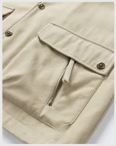 Detail of khaki cargo jacket with classic metal buttons and heavy cotton texture
