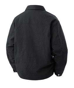 Detail view of charcoal gray jacket featuring textured honeycomb fabric and lapel collar