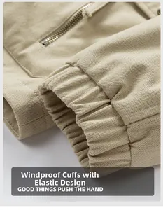 Detail of khaki jacket showing windproof elastic cuffs and a metal zipper sleeve pocket