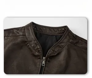 Detail display of brown leather jacket with stand collar and metallic silver zipper