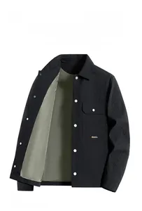 Detail of black seersucker jacket featuring a classic lapel and silver snap button closure