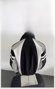 Detailed back view of an oversized color-block windbreaker jacket in black and grey