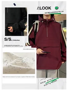Detail of windproof burgundy and black hooded jacket with waterproof T400 oxford fabric