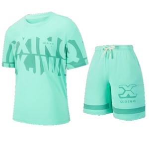 Close-up of mint green breathable mesh fabric on sport t-shirt and drawstring shorts set