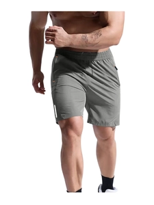 Detail of men's dark grey sports shorts with zipper pockets and reflective stripes