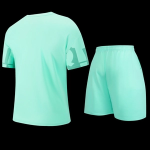 Detailed back view of mint green mesh sports set with geometric prints on sleeves